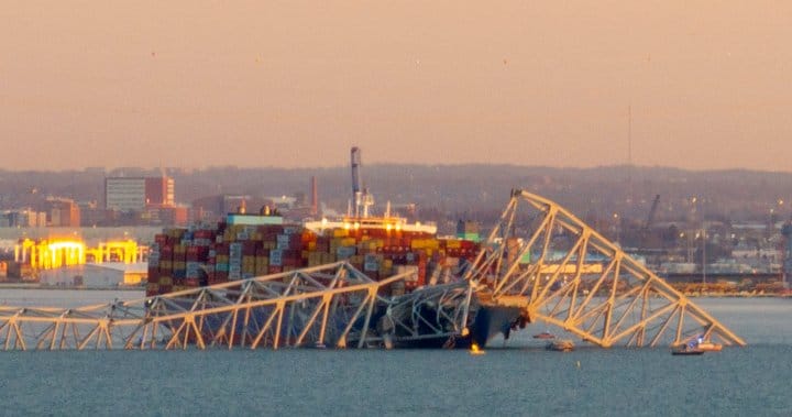 A picture of the container ship the Dali floating amongst the wreckage of the Francis Scott Key bridge